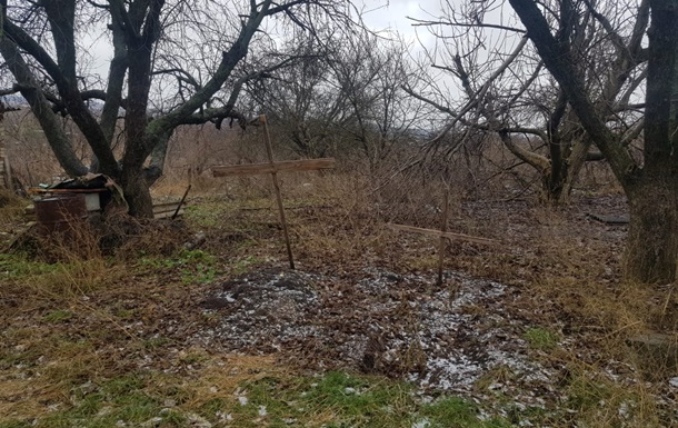 Под Харьковом эксгумировали тела матери и сына, погибших из-за обстрела